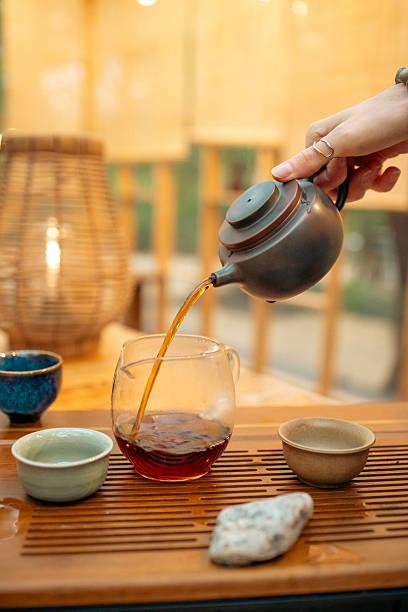 istock Traditional Chinese tea ceremony, pouring oolong tea into a ceramic bowl 2250513774