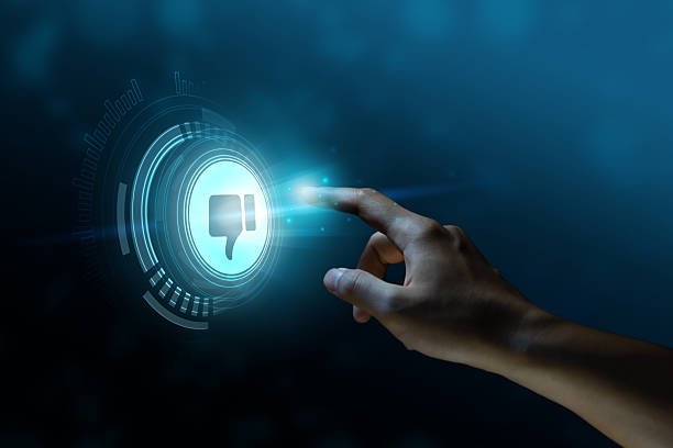 istock itleThe finger is pointing or pressing a dislike or thumb down button on digital screen. icon, display screen, touch screen. 2250515809
