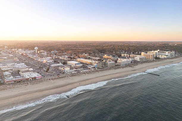The view north along the coast of Rehoboth Beach, Delaware during sunset