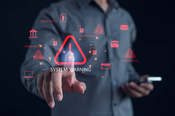 istock business professional interacting with a digital system warning alert, representing cybersecurity risks, data breach threats, malware detection, and secure system protection in modern technology. 2250525893
