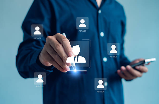istock modern business concept image showing person selecting digital profile icon using a stylus, symbolizing HR technology, recruitment, customer management, data systems, professional digital interaction. 2250525964
