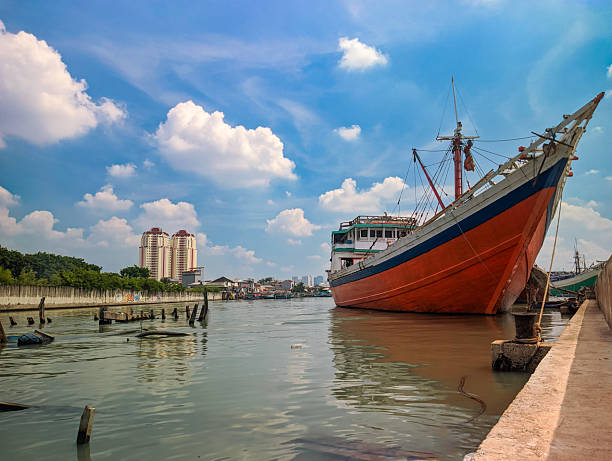 pinisi boat docked at the pier