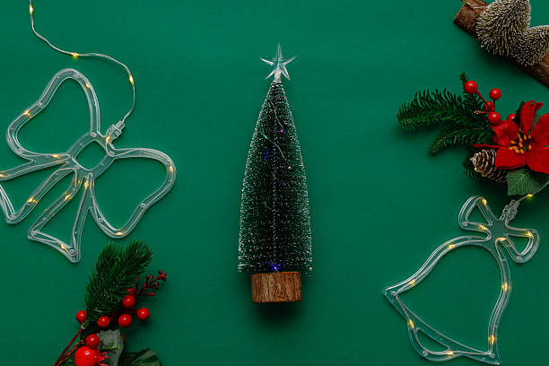 istock Green New Year festive background with Christmas tree and lights 2250530643