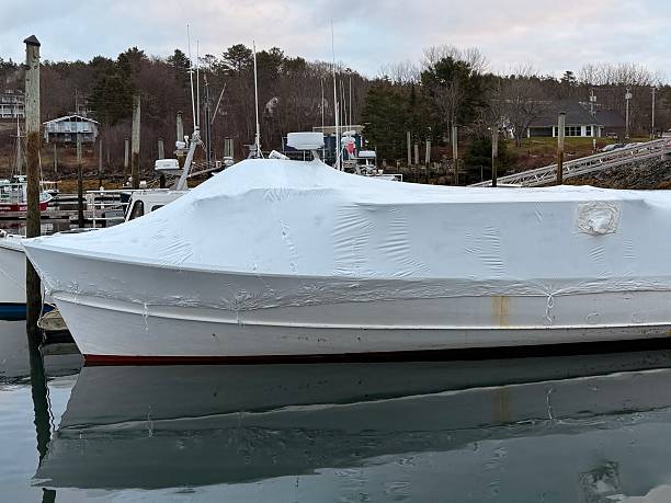 istock Covered Boat for the winter at a marina 2250530832