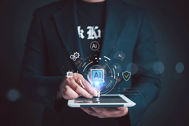 istock Businessman holding a light bulb with AI icon above digital tablet, symbolizing artificial intelligence, innovation, machine learning, and future technology in smart business solutions. 2250532077