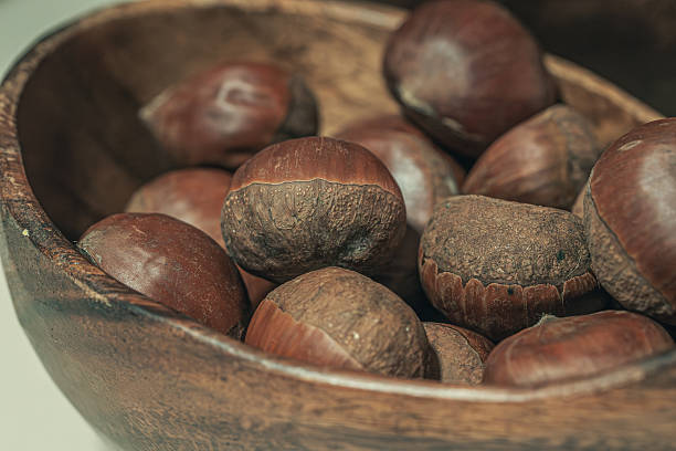 Chestnuts in Rustic Wooden Bowl Close Up