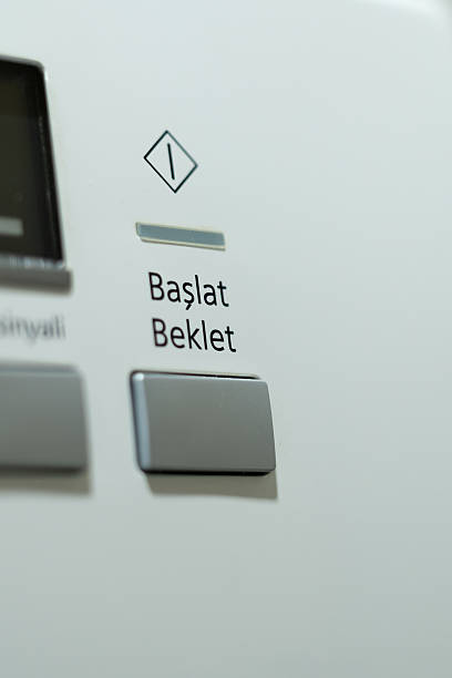 istock Close-Up of Start/Pause Button on Modern Clothes Dryer 2250540376
