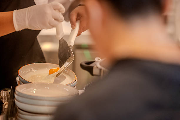 Serving sunny side up eggs restaurant