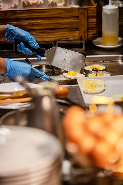 Preparing sunny side up eggs