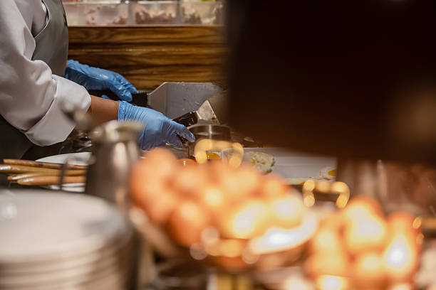 The chef prepares meals in the hotel restaurant.