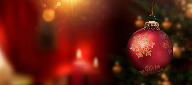istock Red Christmas ball on a christmas tree 2250543867