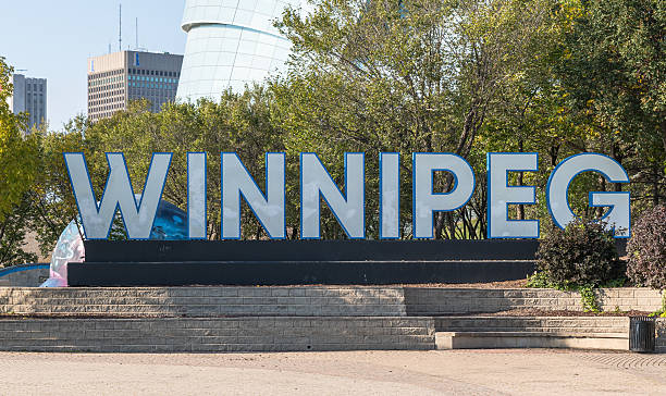 Winnipeg, Manitoba, Canada September 23, 2025 The Winnipeg sign in the Plaza at the Forks and next to the Canadian Museum for Human Rights on a sunny fall day