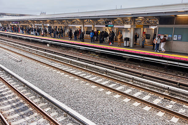 Aerial shot of train passing through Old Oakland, a district in downtown Oakland, California on an overcast day.\n\nAuthorization was obtained from the FAA for this operation in restricted airspace.