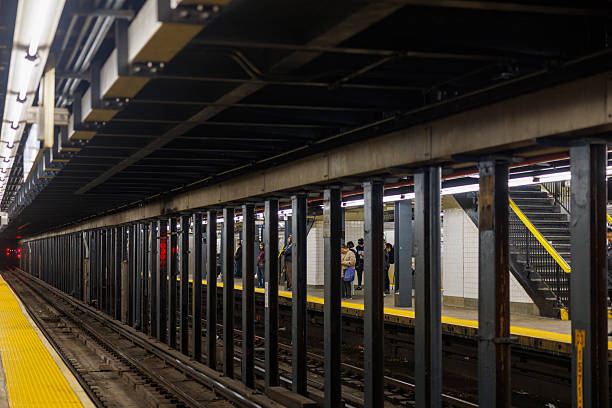 People in a crowded NYC subway train waiting for departure.