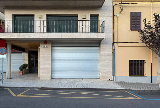 istock Closed metal roller shutter on beige travertine stone facade 2250556502