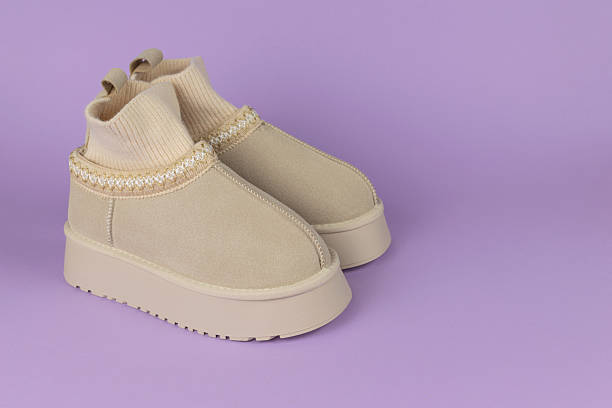 istock Beige Knit Ankle Boots with Platform Sole on Purple Background 2250557182