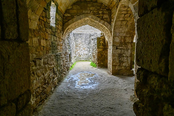 Derbent, Dagestan, Russia - August 23, 2025: Interior view of an ancient stone archway and hallway.