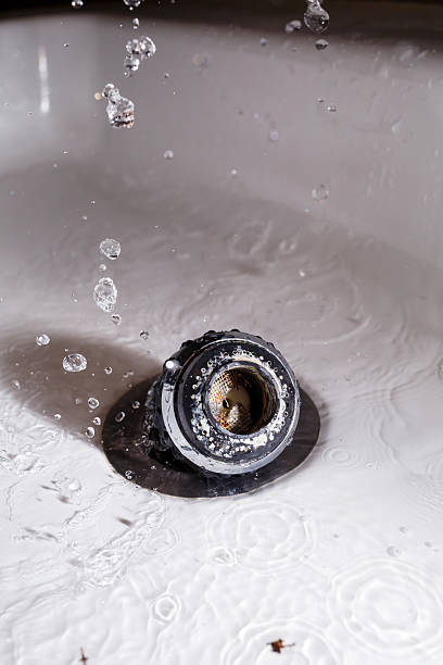 istock Old faucet aerator close-up on a white background. Broken sink mixer. Selective focus 2250558795