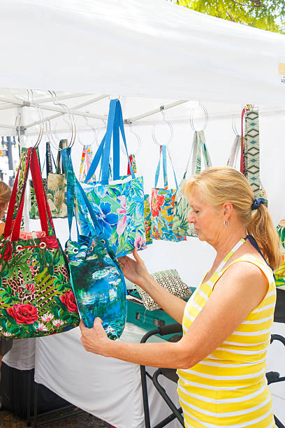istock A woman buys a handbag 2250560411