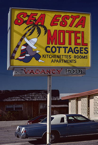 Dewey Beach, Delaware, USA - September 12, 1985 - Classic mid century roadside motel sign listing amenities.  The motel was built in 1961 and closed and demolished in 2024