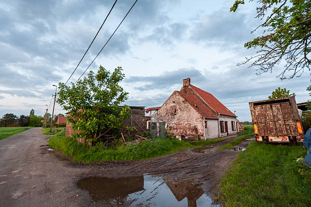 Ghent, Belgium - May 11, 2012. Outdoor scene showing an old derelict farm house near the town of Drongen in east flanders.