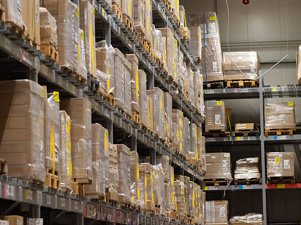 istock Modern industrial warehouse interior with tall shelving and stacked pallets 2250562774