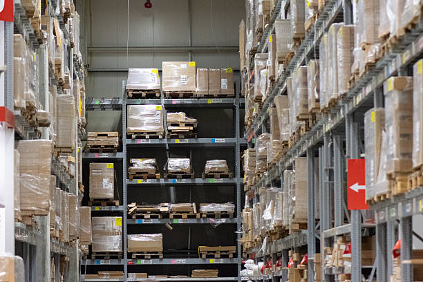 istock Modern industrial warehouse interior with tall shelving and stacked pallets 2250563054