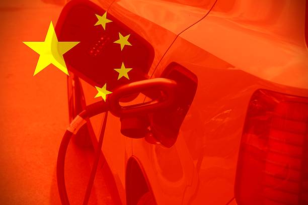 istock Electric car charging by a Chinese flag 2250565650