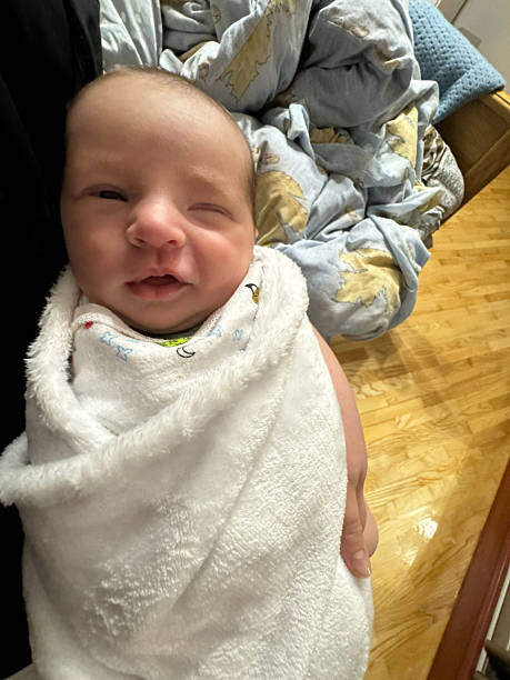 istock Smiling Newborn Baby After Bath Wrapped in Towel 2250570424