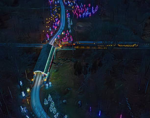 istock Colorful Lights Decorate a Covered Bridge and Pathway During a Nighttime Holiday Event 2250575378