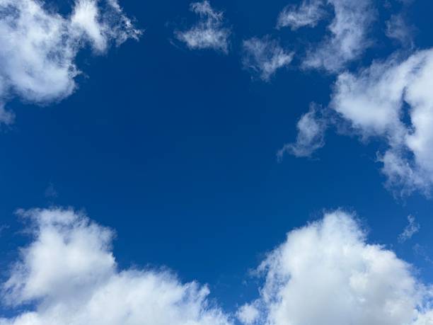 istock Fluffy white clouds in the blue sky. 2250577305