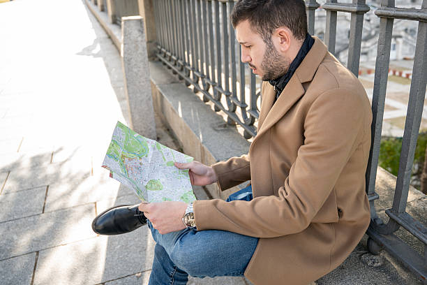 istock Exploring a new city with an old map on a sunny afternoon 2250579989