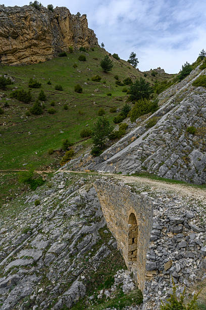 istock Ancient Stone Bridge Amidst Mountainous Terrain 2250580602