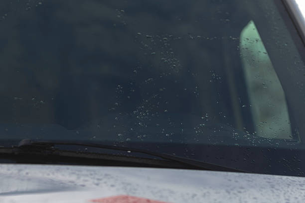 istock Drops stain glass along with marks from wipers and reflections 2250582953