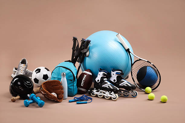 istock Many different sports equipment on beige background 2250586811