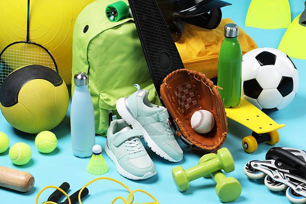 istock Many different sports equipment on light blue background, closeup 2250586983