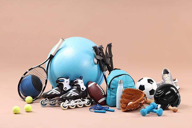 istock Many different sports equipment on beige background 2250587043