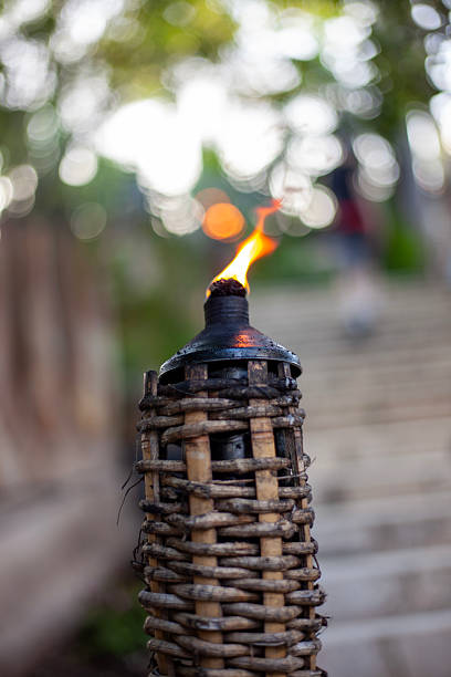 istock A lit tiki torch in a Mexican cemetery. 2250591493