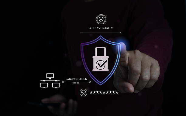 istock Person interacting with a digital shield and lock icon, symbolizing cybersecurity and data protection, securing online networks and ensuring privacy and safe data transactions. 2250592309