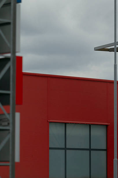 Sleek metalframed industrial structure featuring modular windows and vivid hues