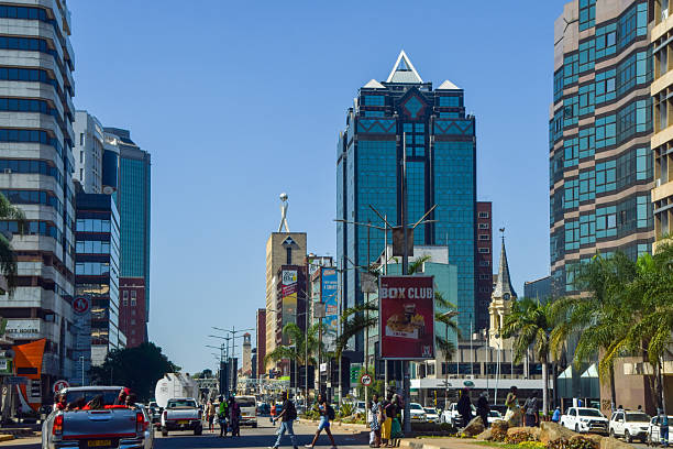 Harare, Zimbabwe - May 5 2024: Daytime view of Samora Machel Avenue in Harare city centre, with incidental people walking.