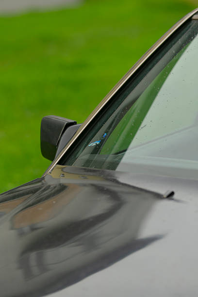 istock Closeup of sleek vehicle with reflective surface and scenery 2250594773