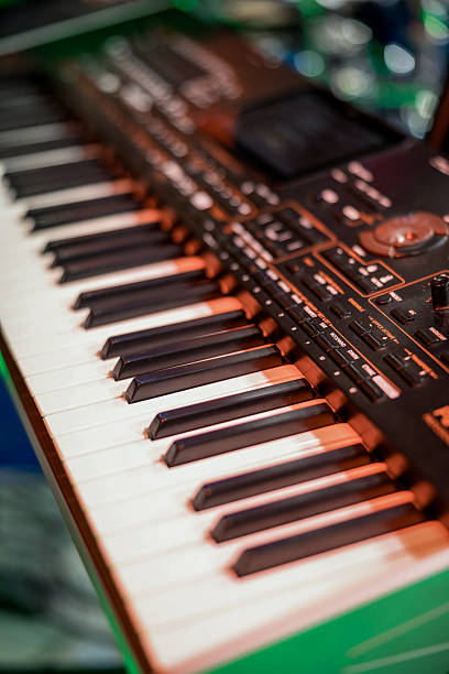An image of a modern electronic piano keyboard captured at an angle, emphasizing texture, design, and rhythm. Ideal for use in educational, musical, or creative industry visuals related to learning, composition, or performance.