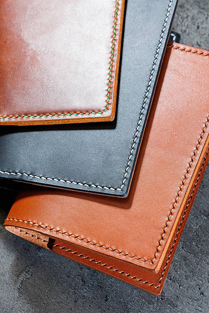 istock Black leather cardholder on a gray background. Handmade leather products. 2250598345