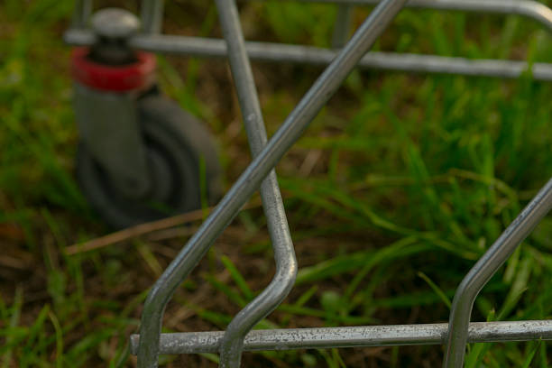 istock Closeup of trolley wheel on grass showing surface deterioration and fixes 2250599719