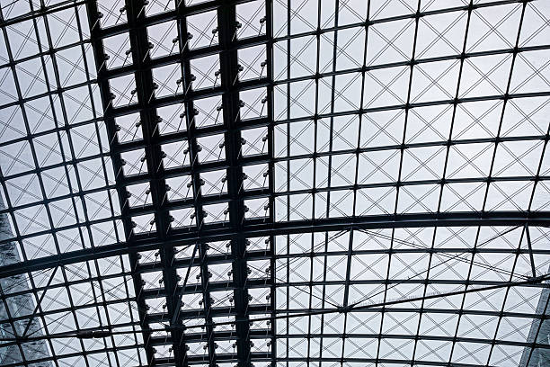 Modern interior inside a railway station with a glass roof