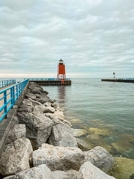 istock Red Lighthouse at the End of the Pier 2250602510