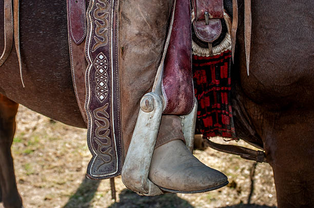 Close-up of Mexican Charro boot nestled in leather Charro stirrup.Taken in Los Banos, California, USA