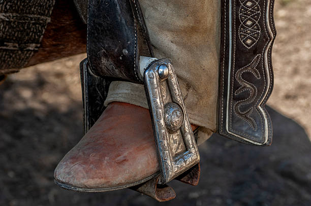 Close-up of Mexican Charro boot nestled in silver Charro stirrup.Taken in Los Banos, California, USA