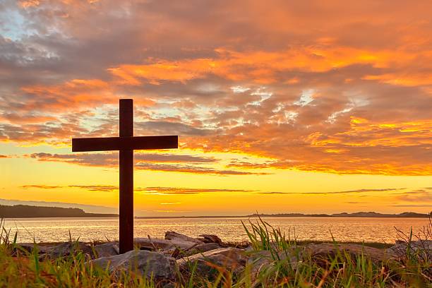 istock Christian Cross River Mouth Sunset 2250609052